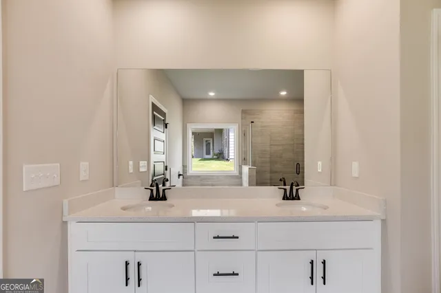 a bathroom with a sink and a mirror