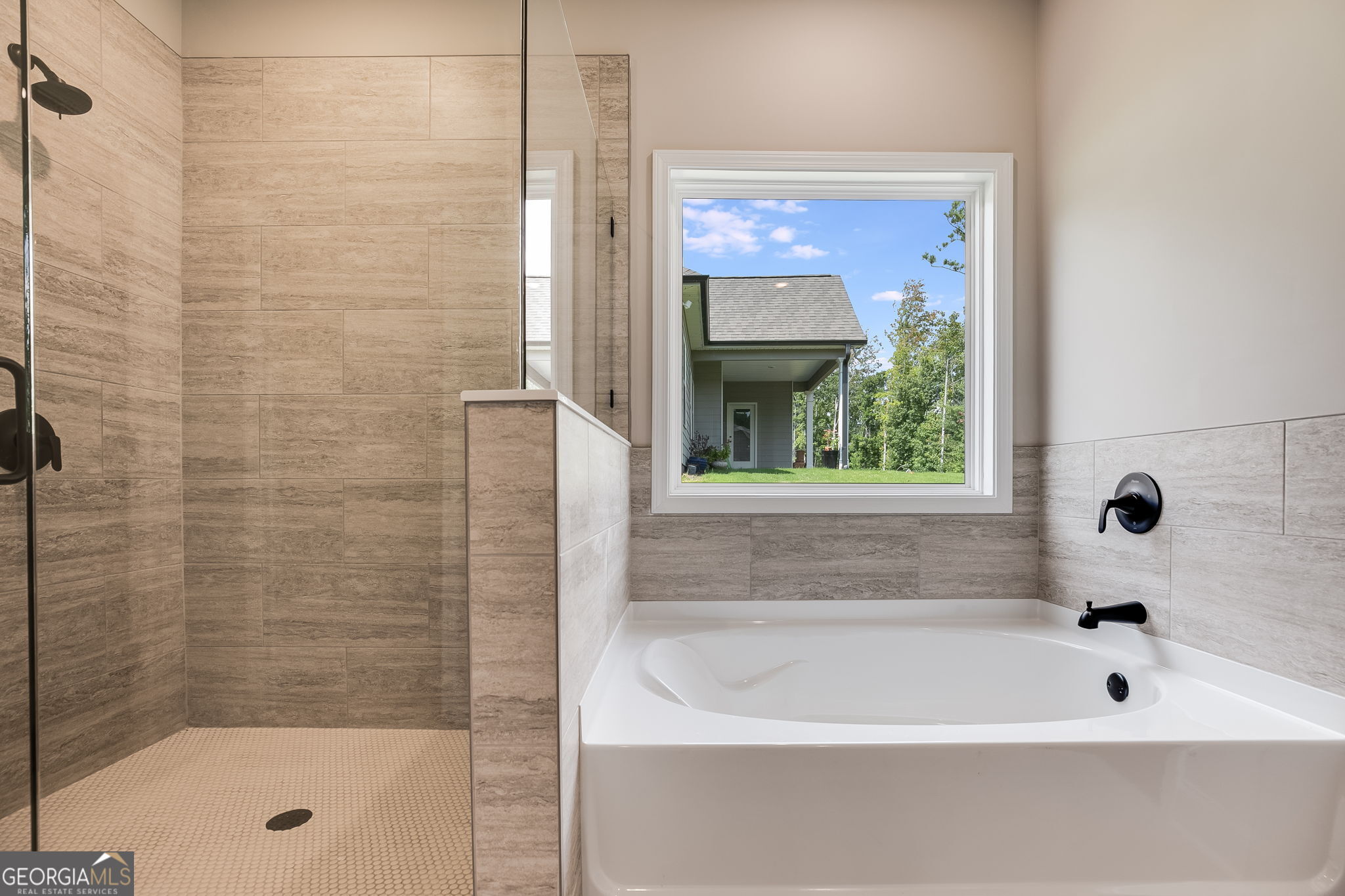 8970 Callaway Drive Winston, GA 30187 - Photo 17 of 24 a bathroom with a bathtub and shower