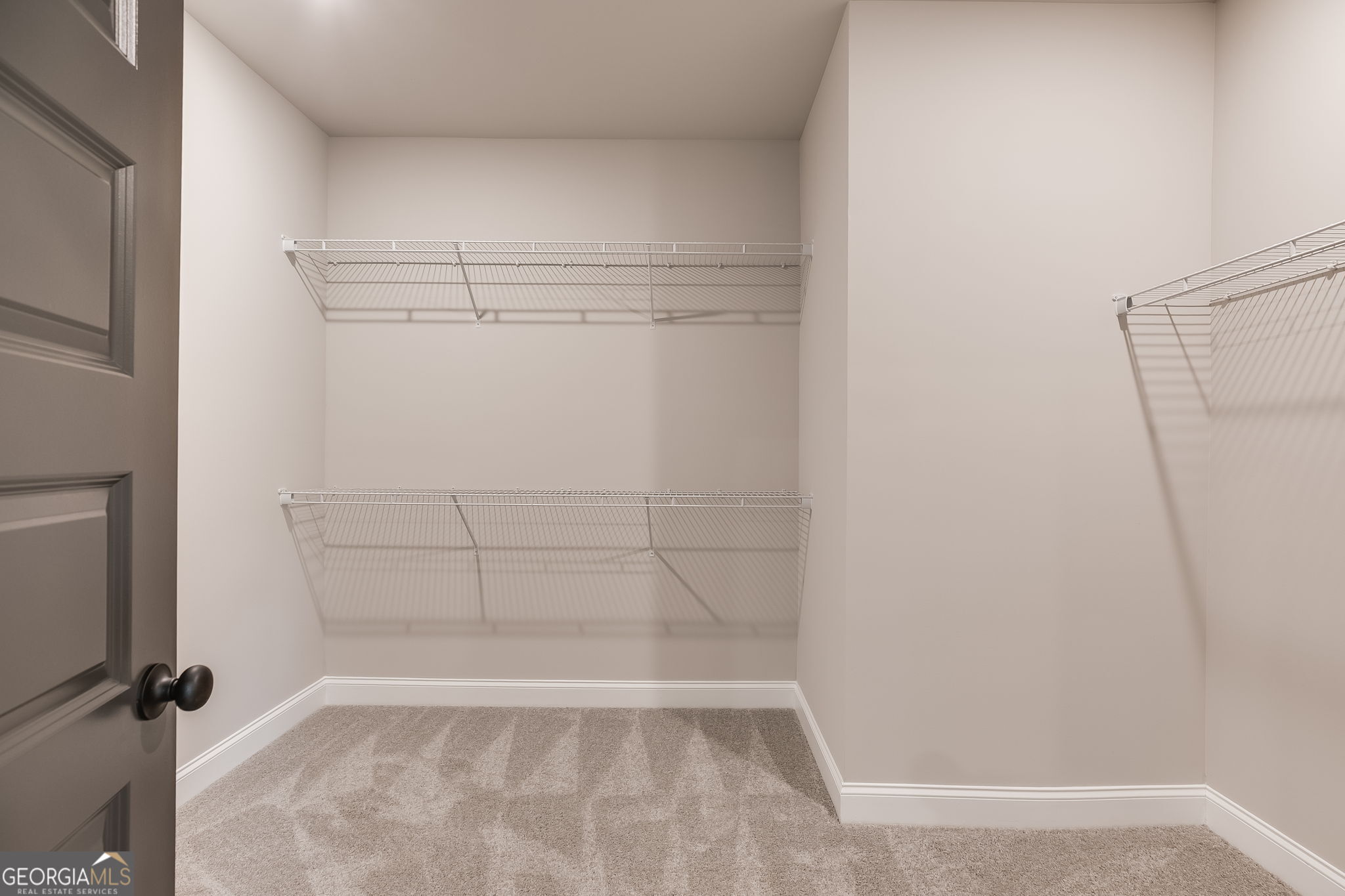 8970 Callaway Drive Winston, GA 30187 - Photo 19 of 24 a view of a room with racks on the wall