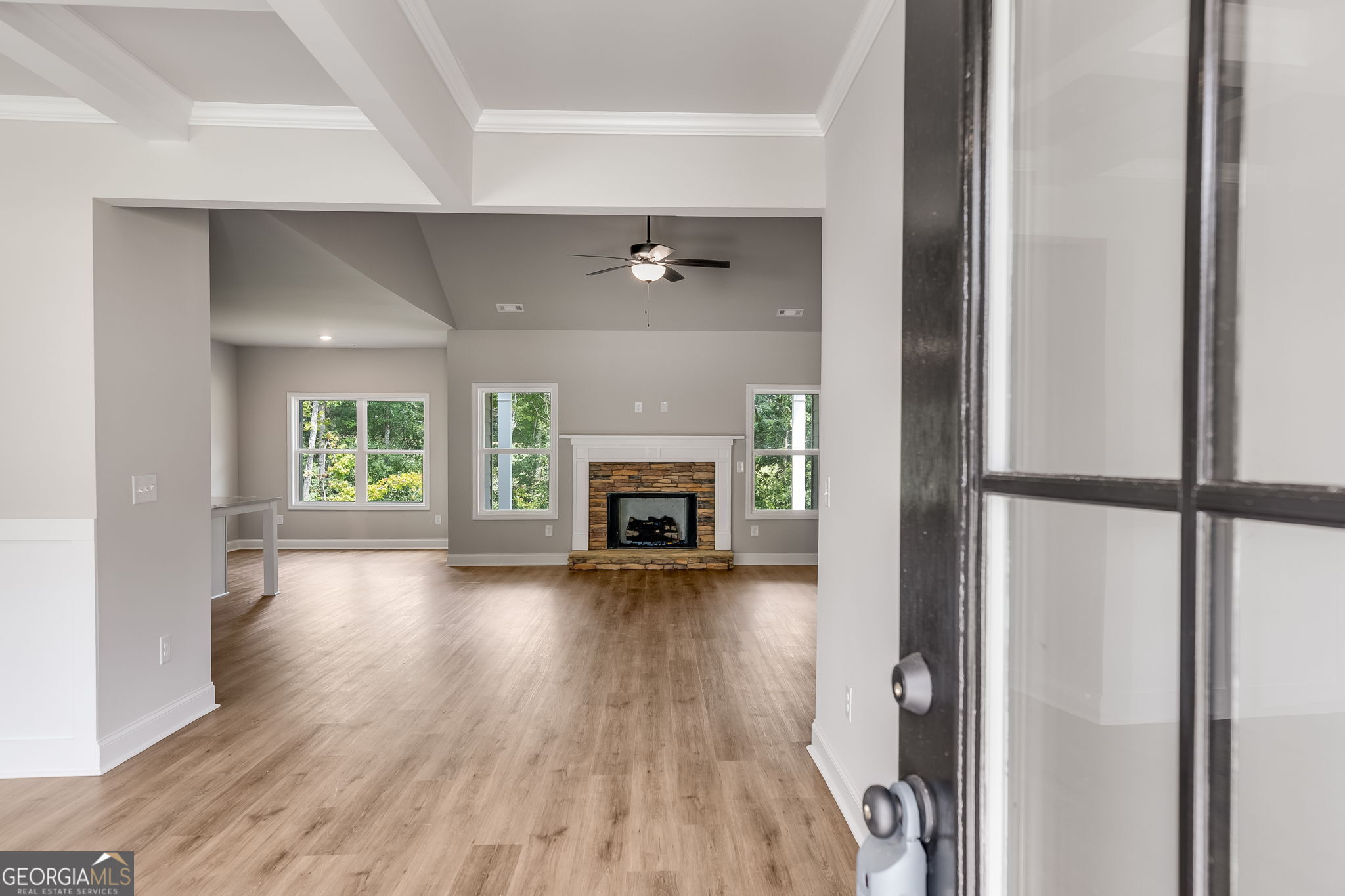 8970 Callaway Drive Winston, GA 30187 - Photo 2 of 24 a view of a hallway with wooden floor and a fireplace