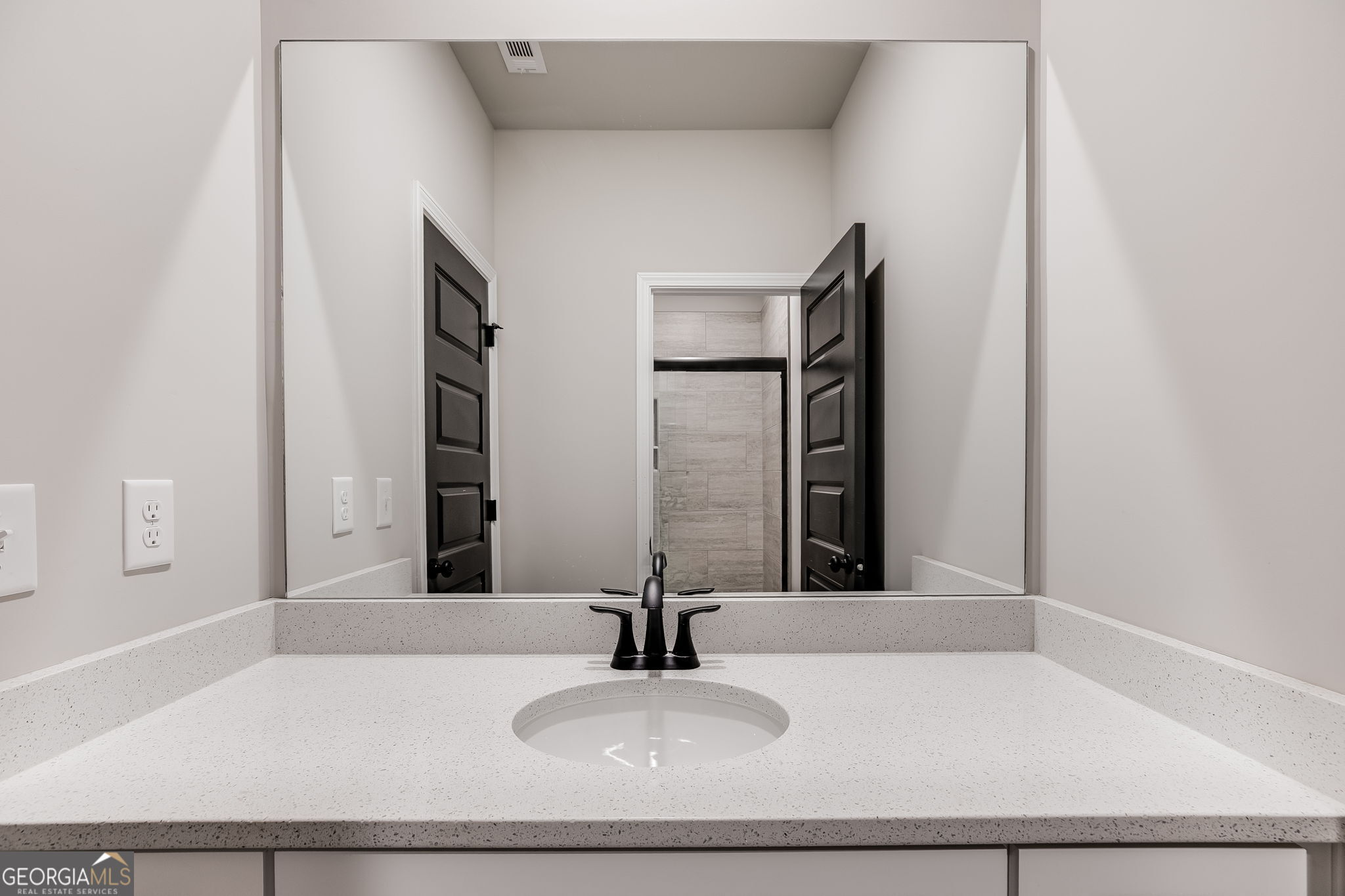 8970 Callaway Drive Winston, GA 30187 - Photo 22 of 24 a bathroom with a sink and a mirror