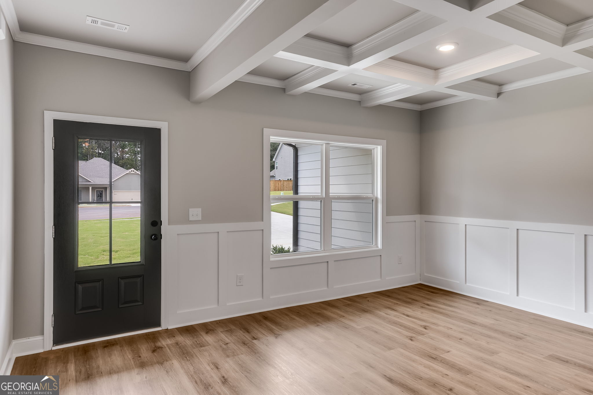 8970 Callaway Drive Winston, GA 30187 - Photo 3 of 24 an empty room with wooden floor and windows
