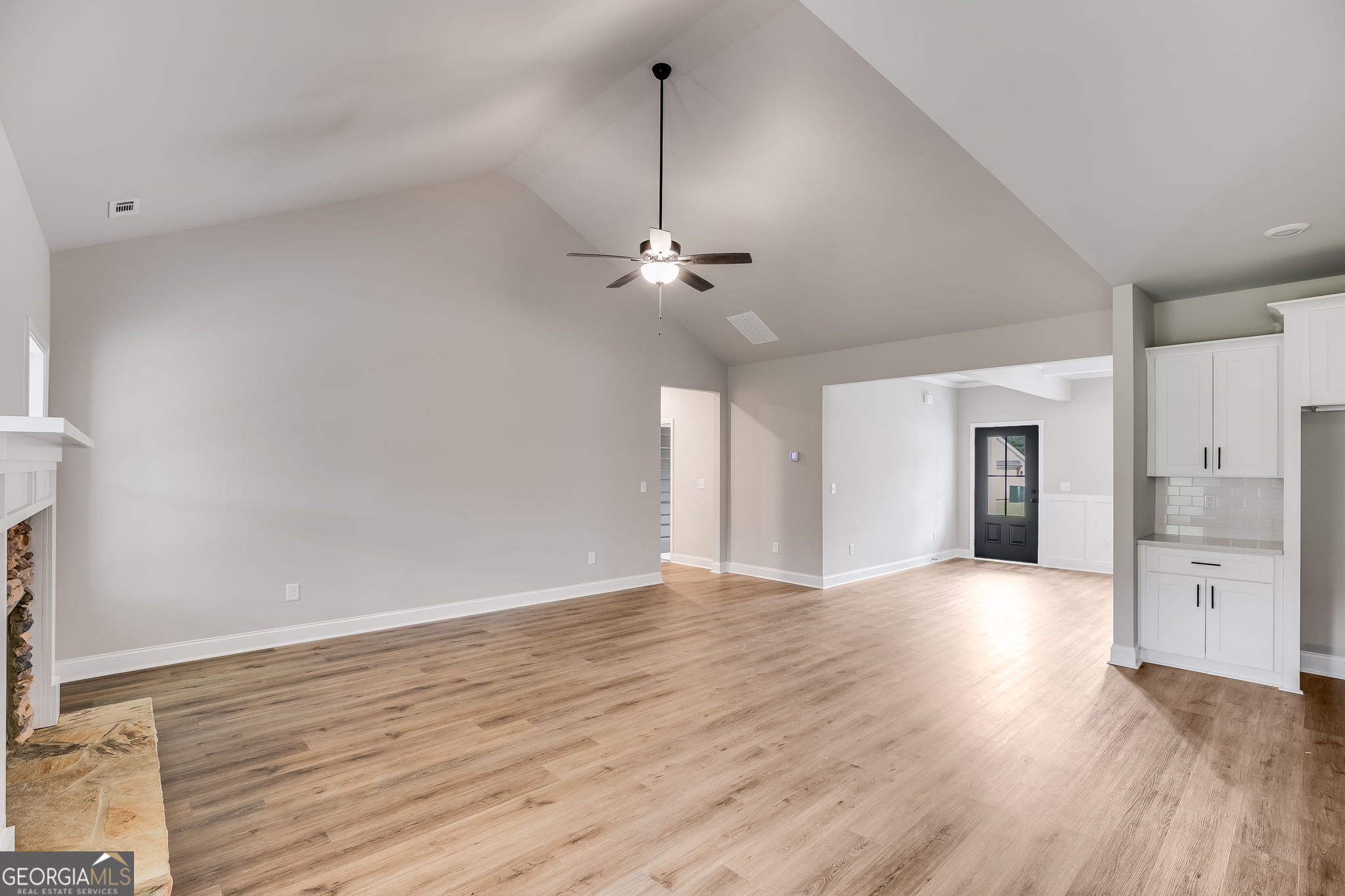 8970 Callaway Drive Winston, GA 30187 - Photo 9 of 24 a view of an empty room with a window and wooden floor