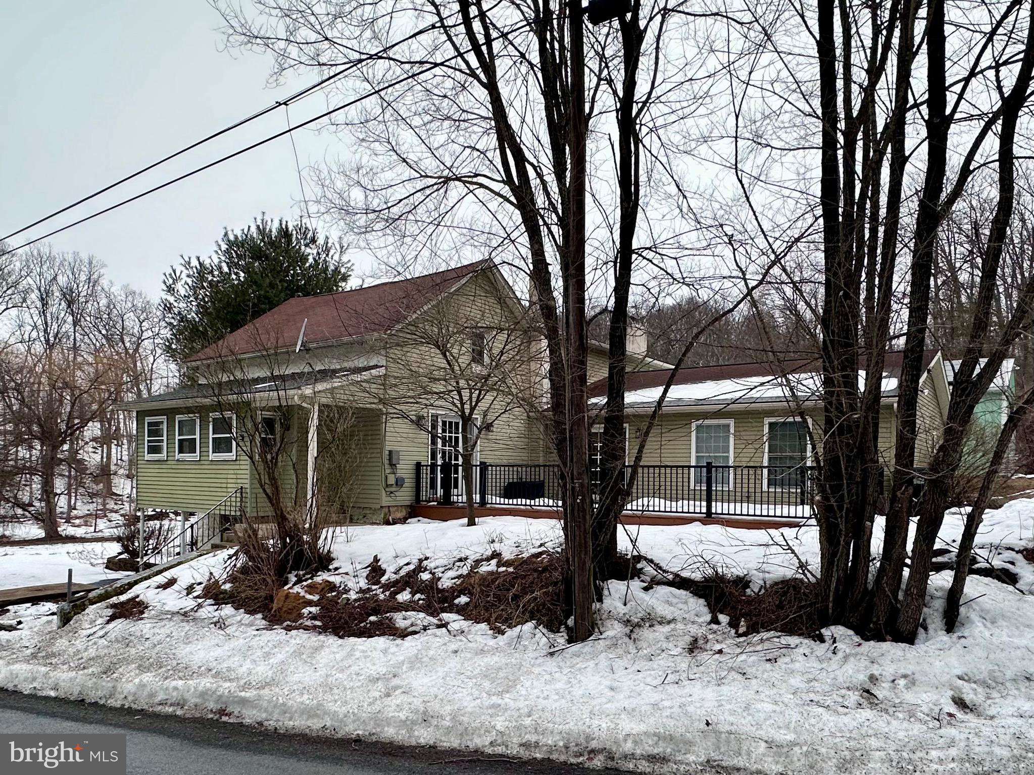 707 Dunkels Church Road Kutztown, PA 19530 - Photo 1 of 37 a view of a house with a yard covered in snow
