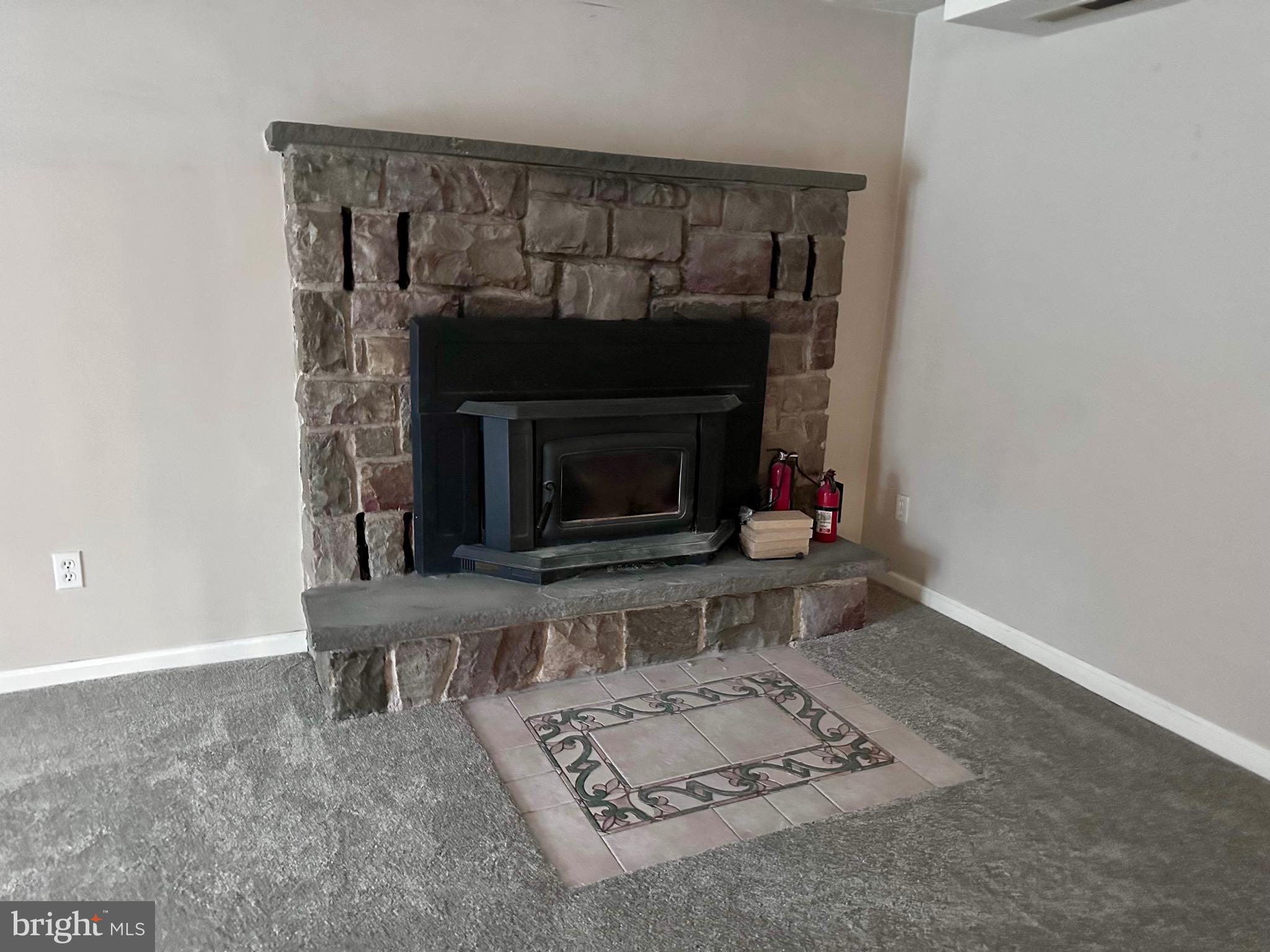 707 Dunkels Church Road Kutztown, PA 19530 - Photo 13 of 37 a living room with furniture and a fireplace