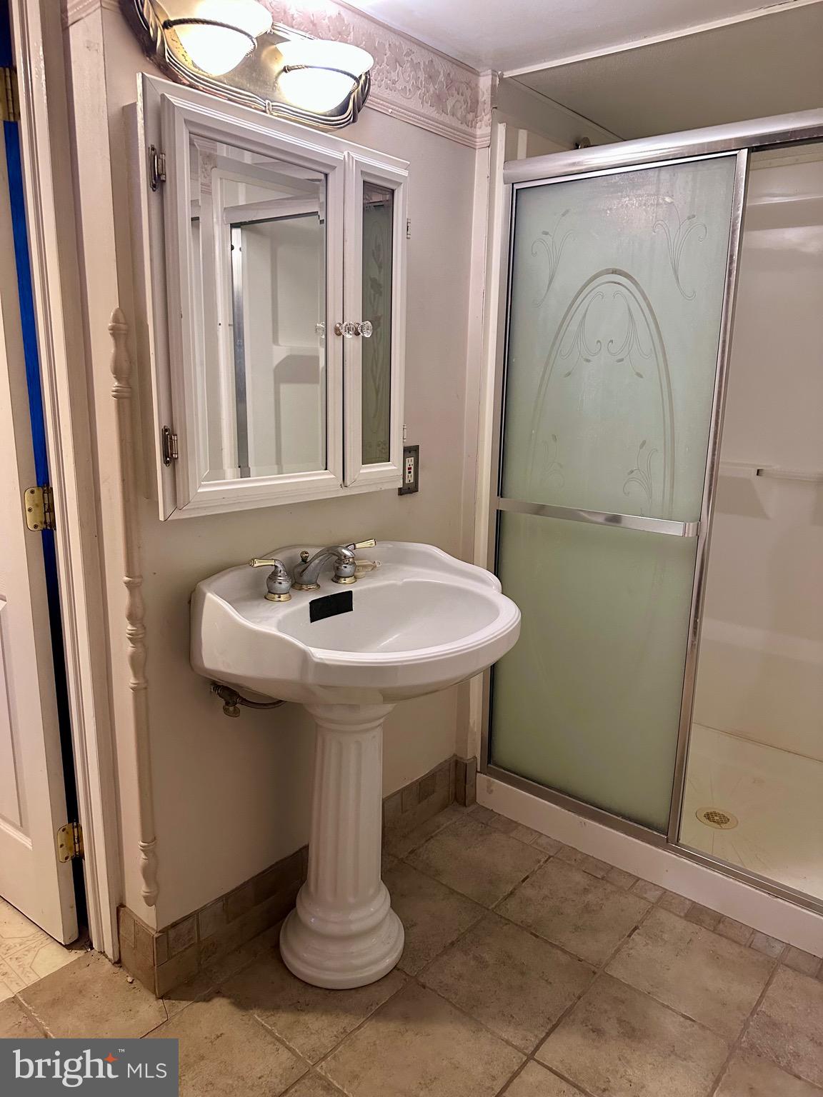 707 Dunkels Church Road Kutztown, PA 19530 - Photo 22 of 37 a bathroom with a sink a mirror and vanity