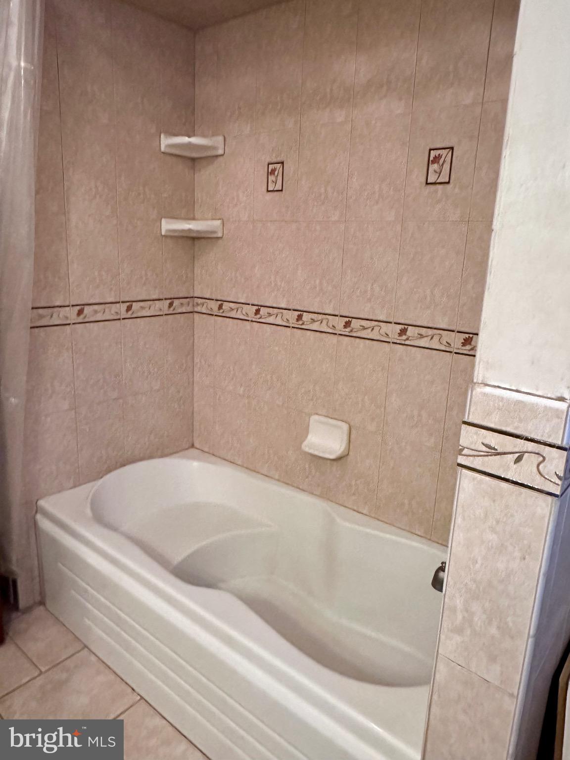 707 Dunkels Church Road Kutztown, PA 19530 - Photo 27 of 37 a bath tub sitting next to a white sink and vanity