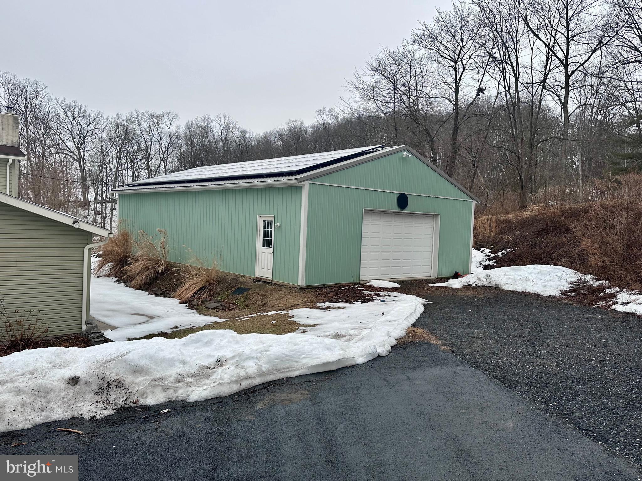 707 Dunkels Church Road Kutztown, PA 19530 - Photo 33 of 37 a backyard of a house with large trees and wooden fence