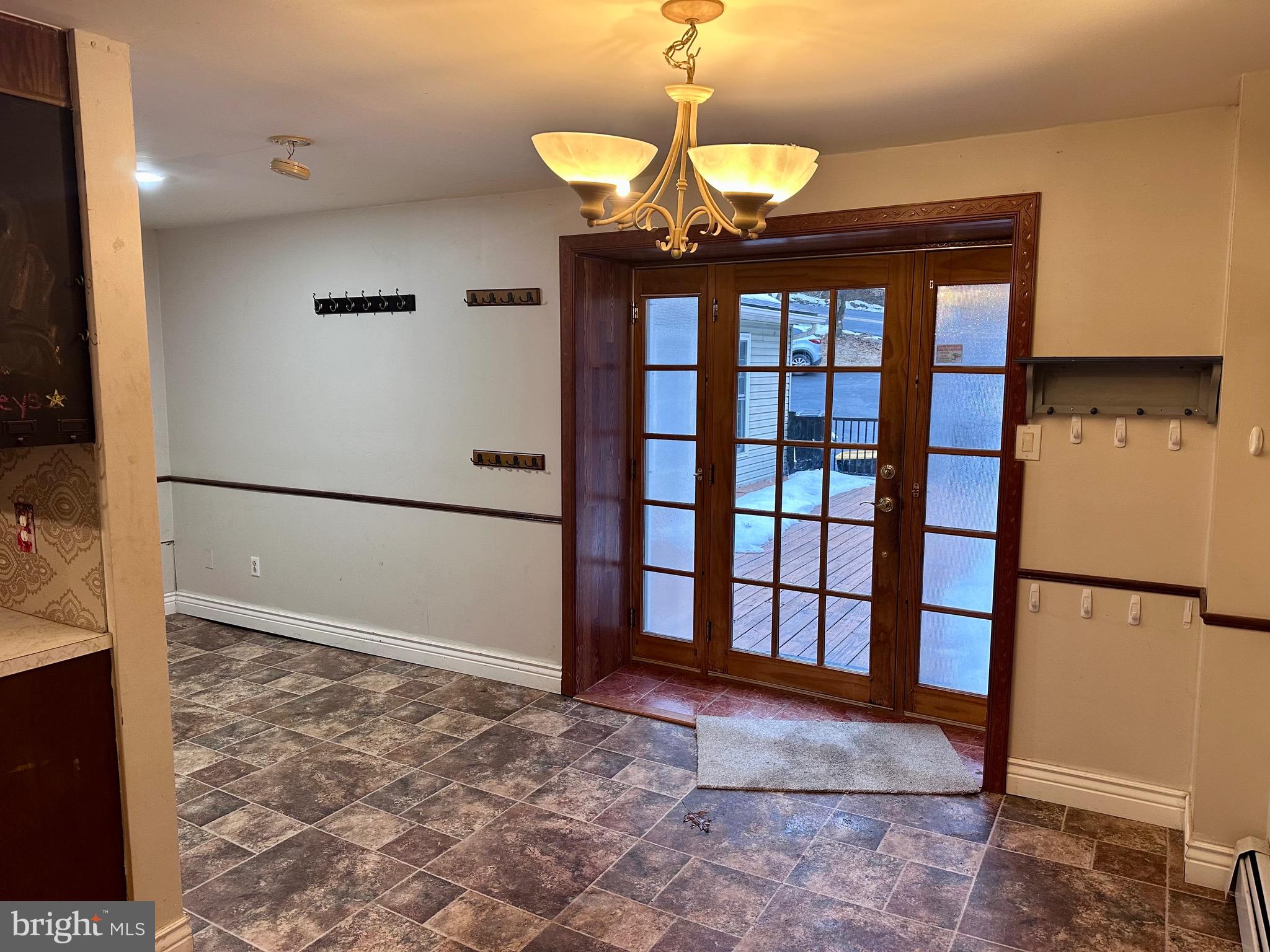 707 Dunkels Church Road Kutztown, PA 19530 - Photo 5 of 37 a view of a hallway with a chandelier