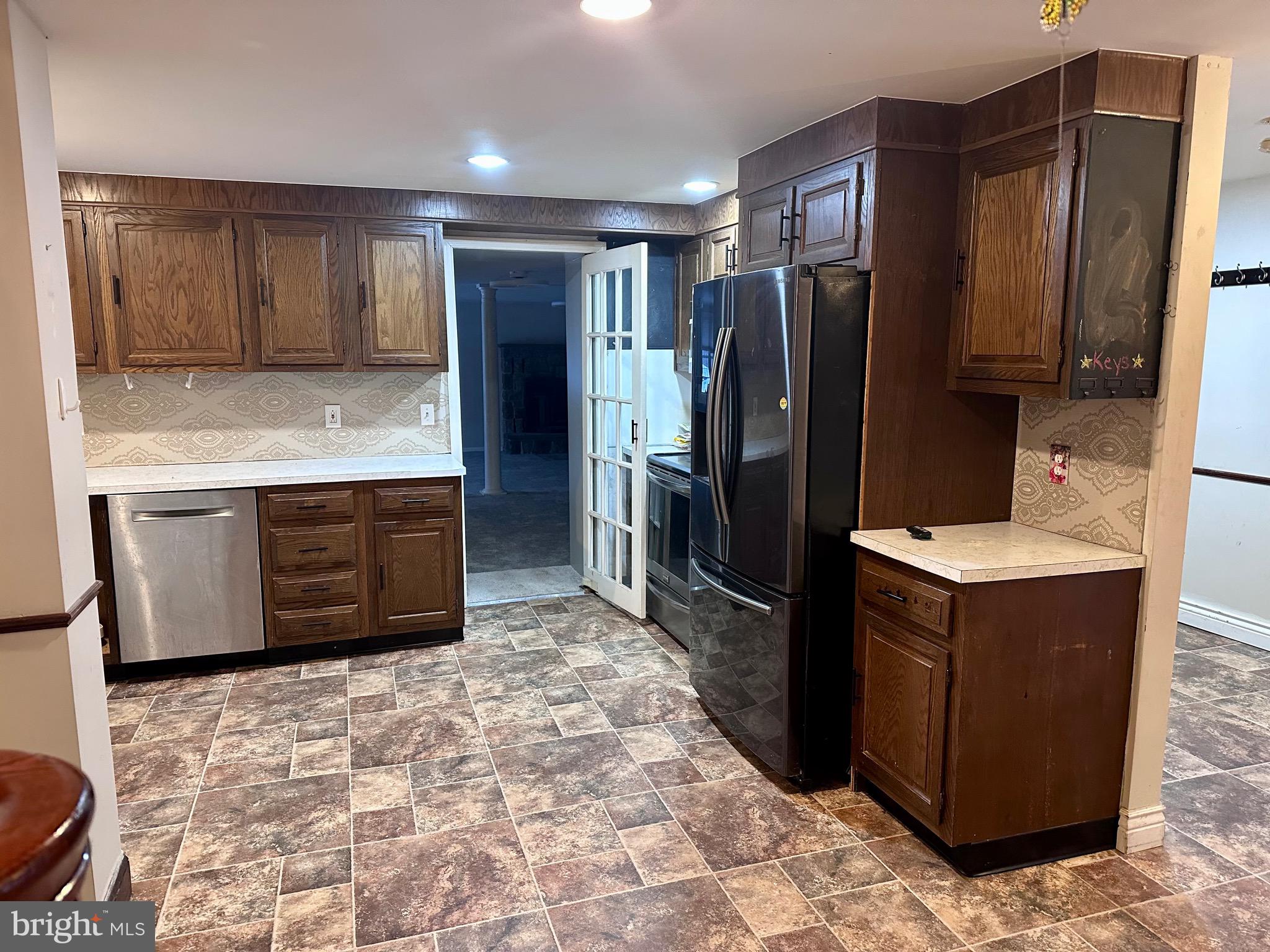 707 Dunkels Church Road Kutztown, PA 19530 - Photo 6 of 37 a kitchen with stainless steel appliances granite countertop a refrigerator and a stove