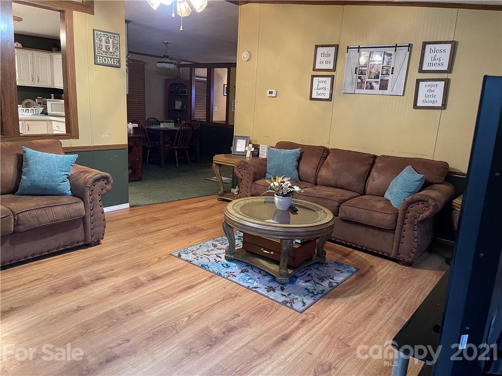 141 Allen Loop Road Rutherfordton, NC 28139 - Photo 16 of 30 a living room with furniture and a dining table