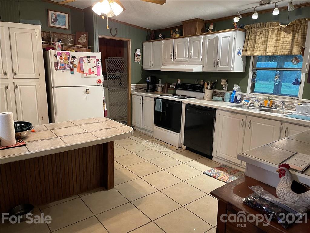 141 Allen Loop Road Rutherfordton, NC 28139 - Photo 20 of 30 a kitchen with a sink appliances and cabinets