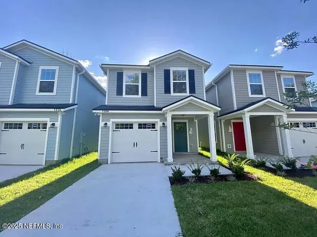 a view of house with yard and entertaining space