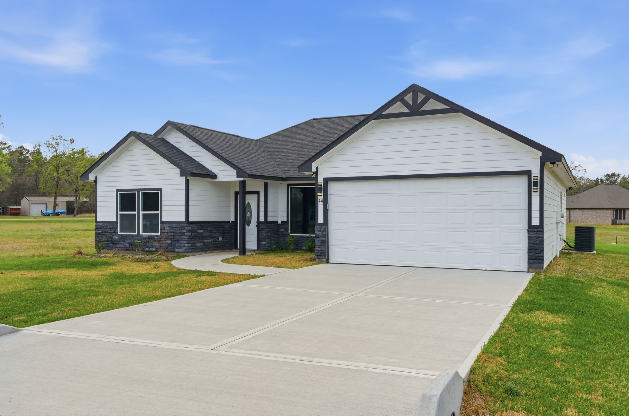 44 Meadow Lake Drive Trinity, TX 75862 - Photo 2 of 39 a front view of house with yard and green space