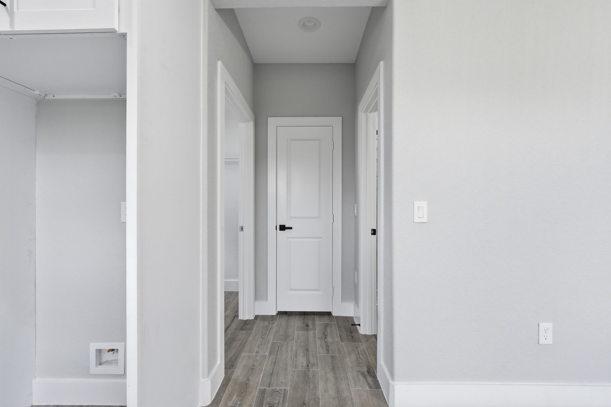 44 Meadow Lake Drive Trinity, TX 75862 - Photo 31 of 39 a view of a hallway with wooden floor