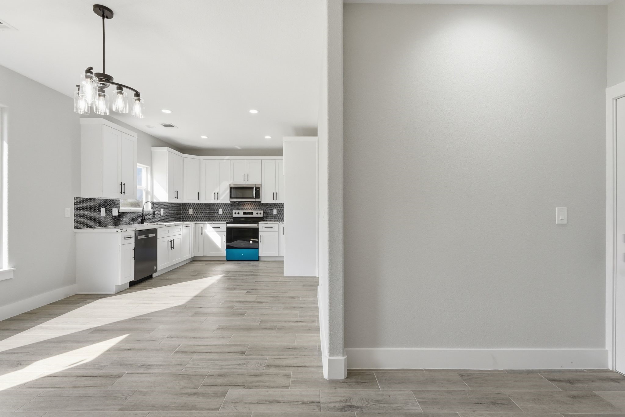 44 Meadow Lake Drive Trinity, TX 75862 - Photo 5 of 39 a large kitchen with a refrigerator and a stove top oven