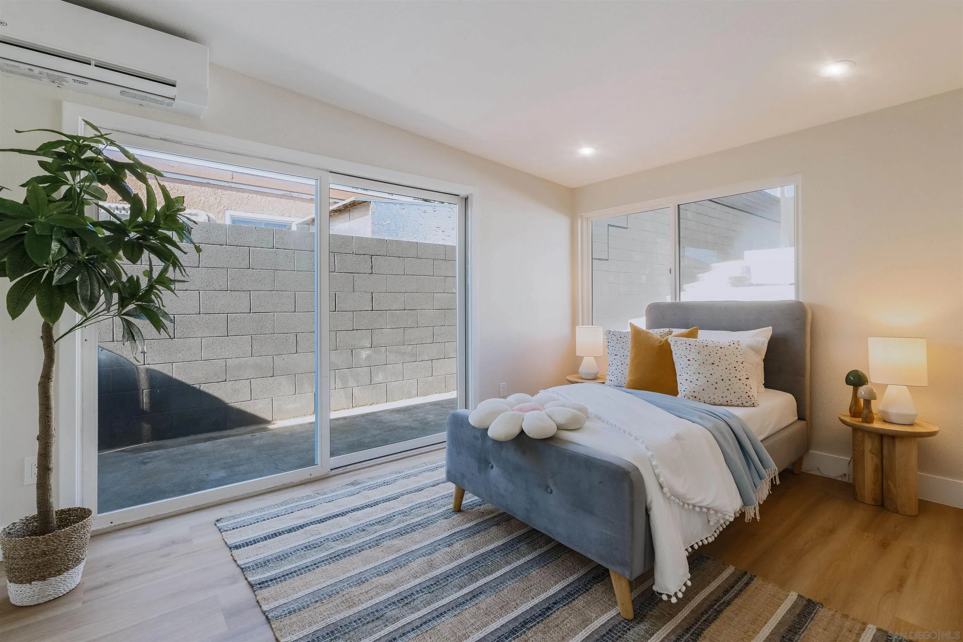 1426 Santa Rosa Street Oceanside, CA 92058 - Photo 46 of 73 a bedroom with a bed and a potted plant