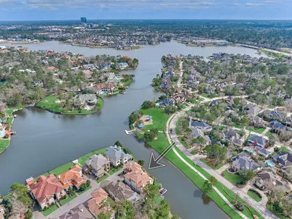 an aerial view of a house with a lake view