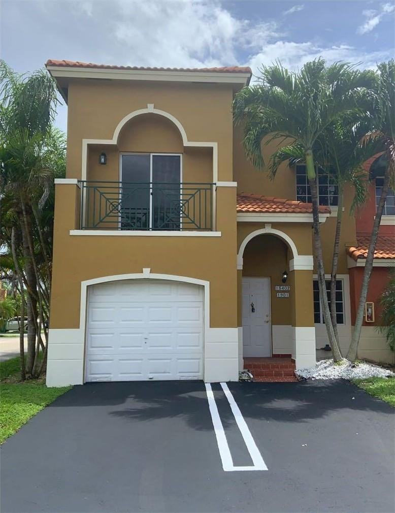 a front view of a house with a garage