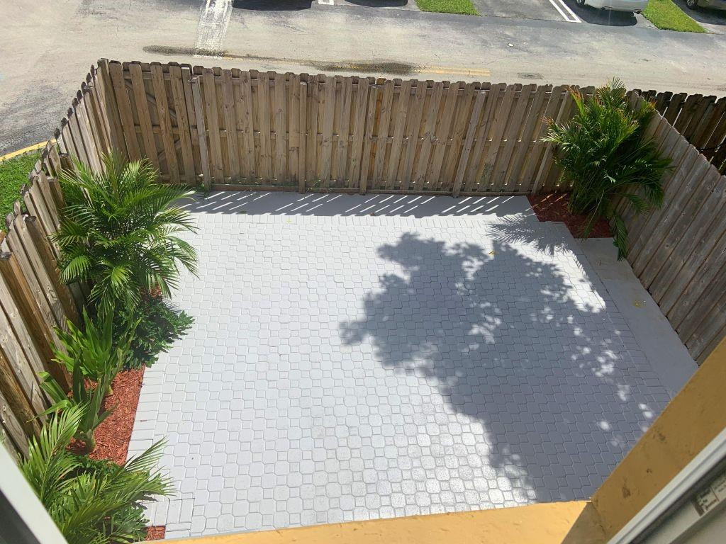 13402 Southwest 153rd Street, Unit 1901 Miami, FL 33177 - Photo 2 of 17 a view of wooden fence