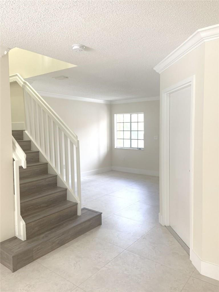 13402 Southwest 153rd Street, Unit 1901 Miami, FL 33177 - Photo 5 of 17 a view of entryway and hall with a window