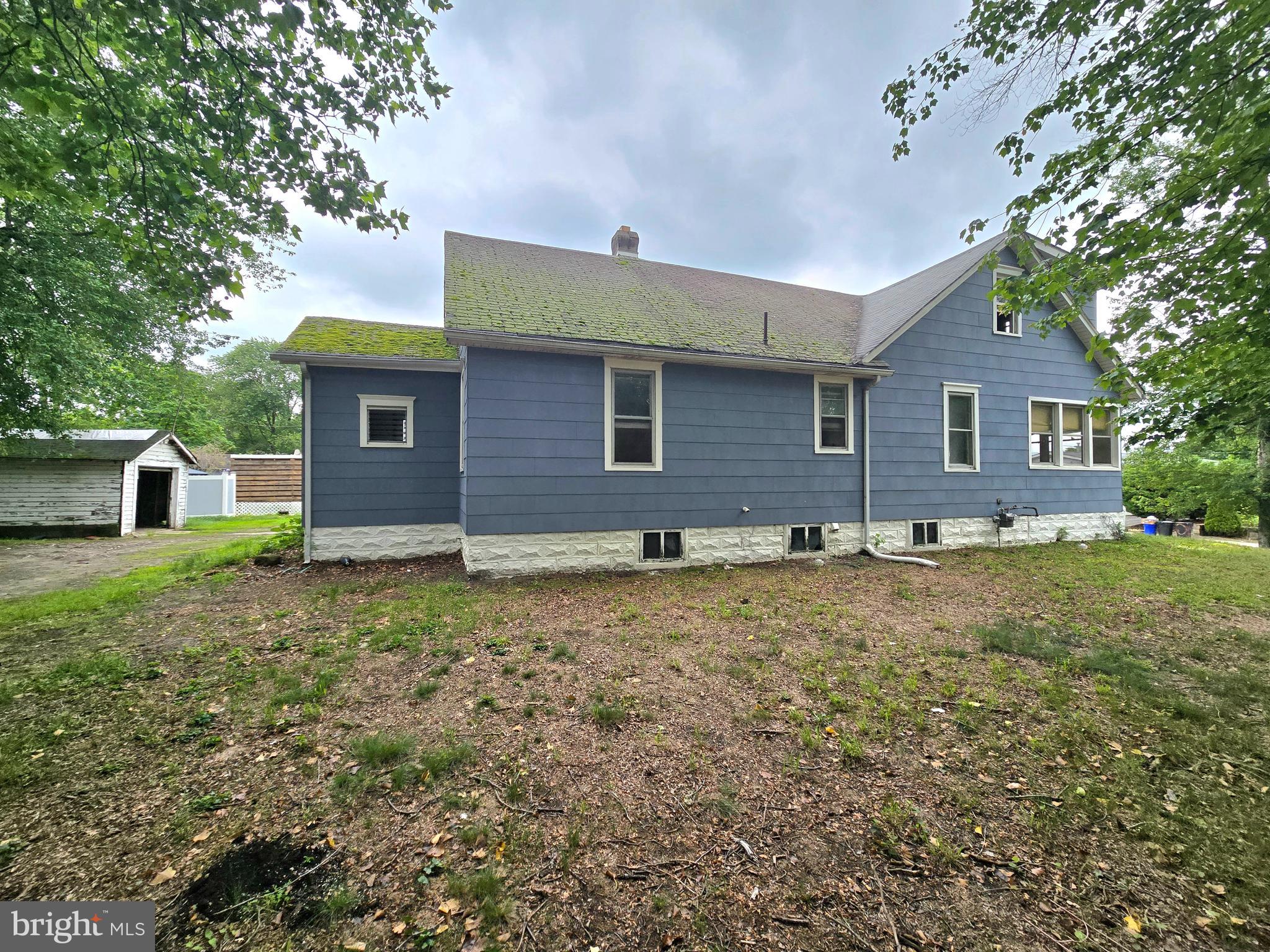 36 Atlantic Avenue Clementon, NJ 08021 - Photo 17 of 19 a brick house with a yard