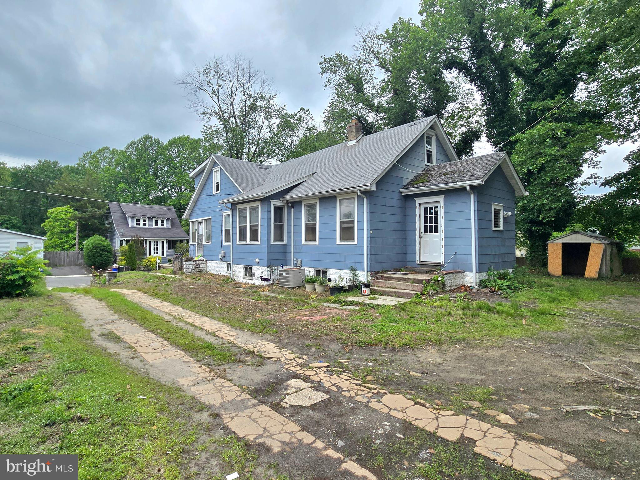 36 Atlantic Avenue Clementon, NJ 08021 - Photo 3 of 19 a front view of a house with a garden
