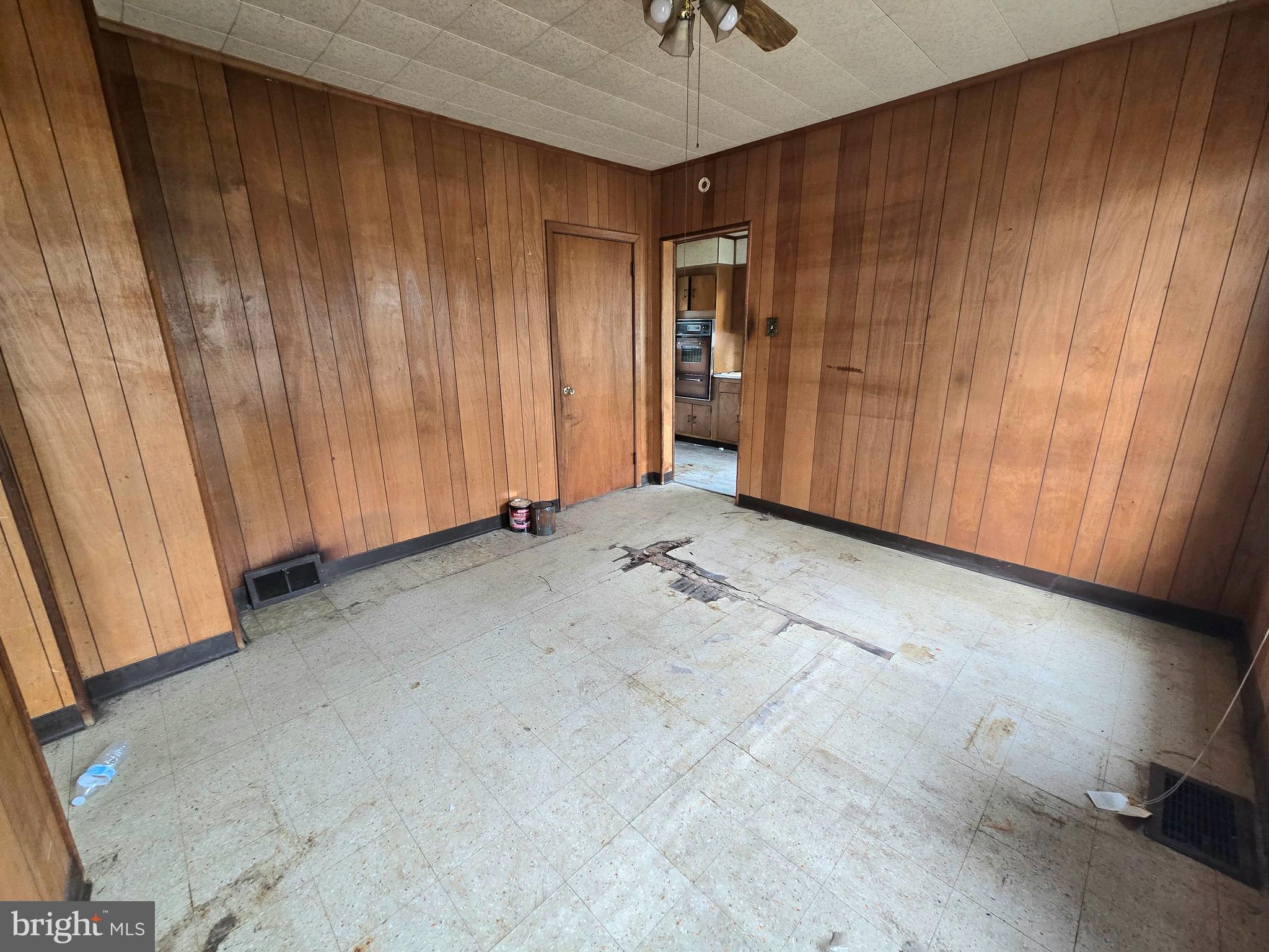 36 Atlantic Avenue Clementon, NJ 08021 - Photo 8 of 19 an empty room with a wooden door