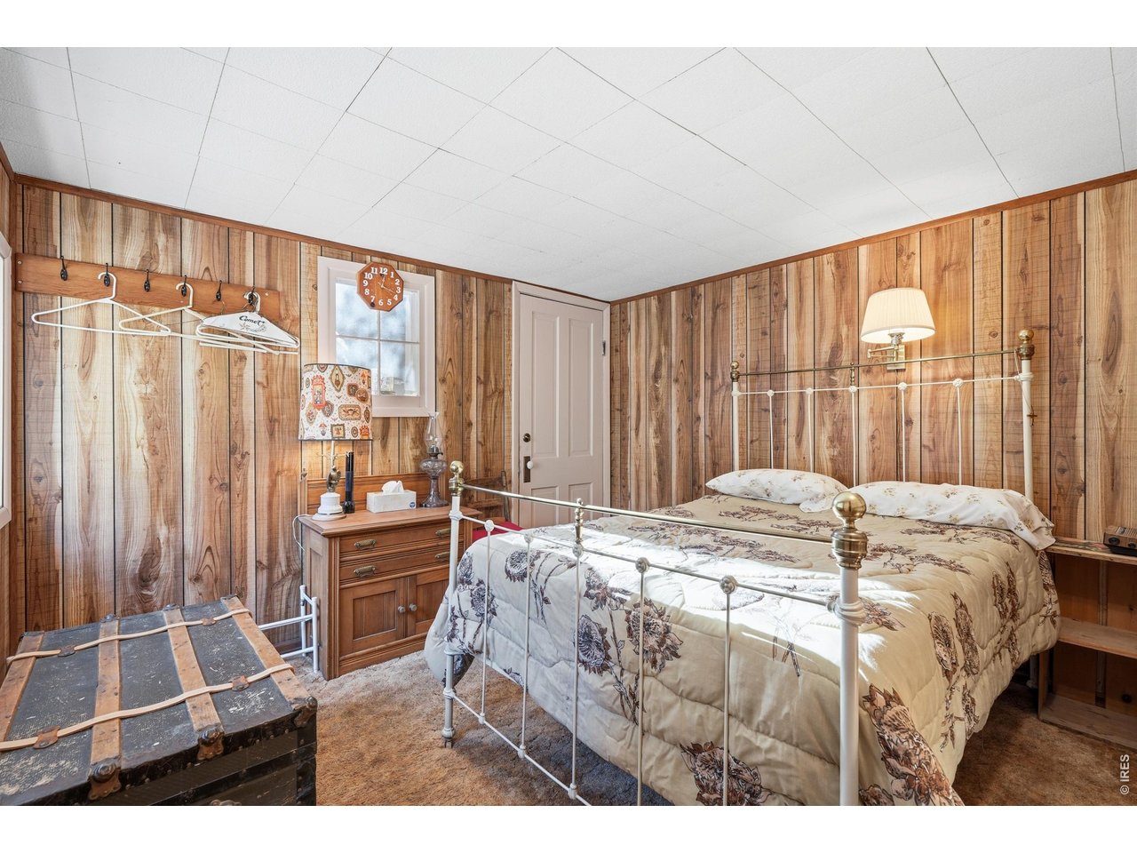 2476 Riverside Drive Lyons, CO 80540 - Photo 12 of 42 a bed sitting in a spacious bedroom next to a window