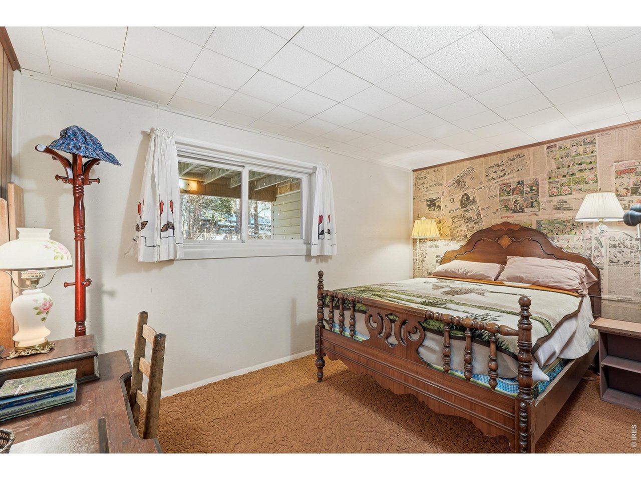 2476 Riverside Drive Lyons, CO 80540 - Photo 14 of 42 a bedroom with a bed window and a table