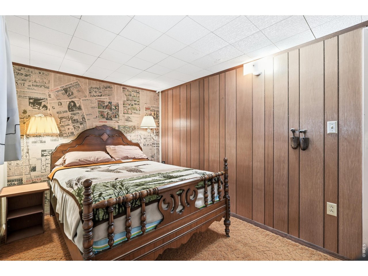 2476 Riverside Drive Lyons, CO 80540 - Photo 15 of 42 a bedroom with a bed table and a window