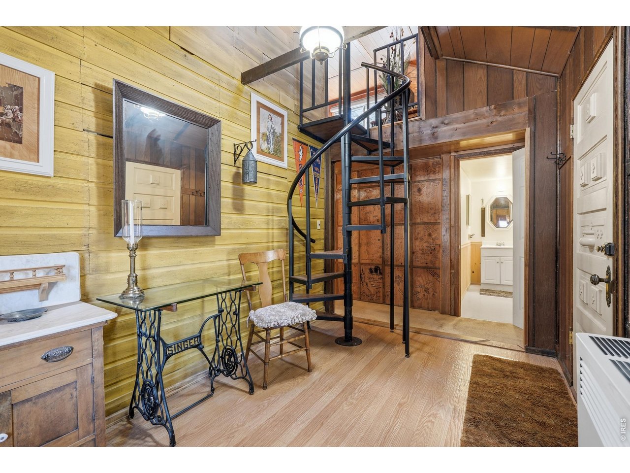 2476 Riverside Drive Lyons, CO 80540 - Photo 17 of 42 a view of a hallway with wooden floor and stairs