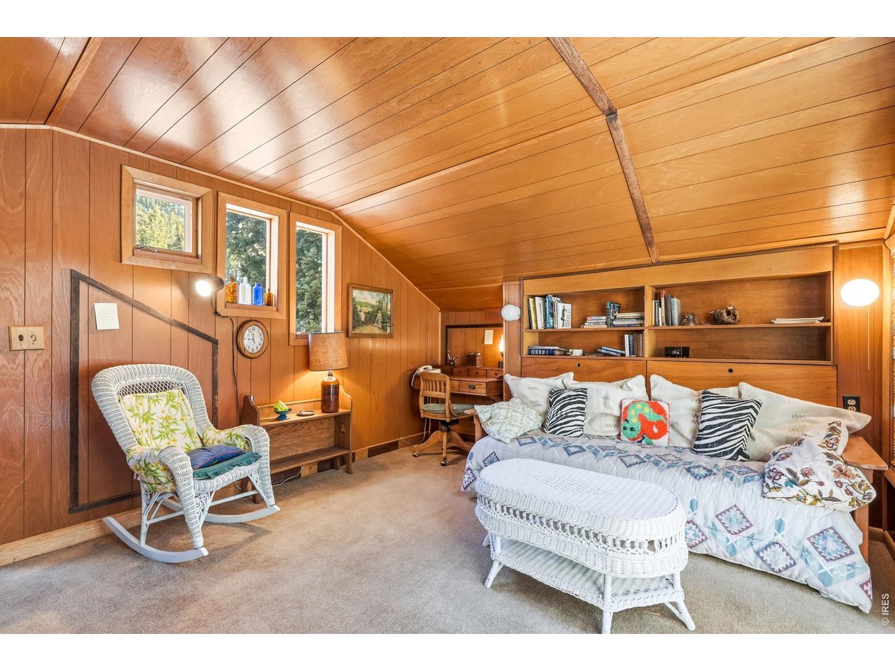 2476 Riverside Drive Lyons, CO 80540 - Photo 19 of 42 a living room with furniture and a floor to ceiling window