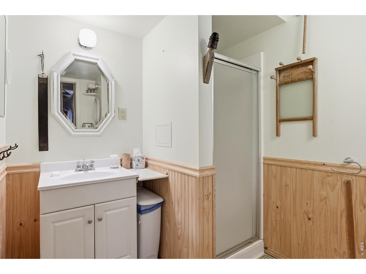 2476 Riverside Drive Lyons, CO 80540 - Photo 23 of 42 a bathroom with a sink vanity and a mirror