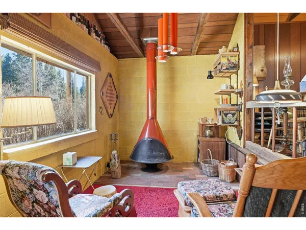 a bedroom with a bed window and a table