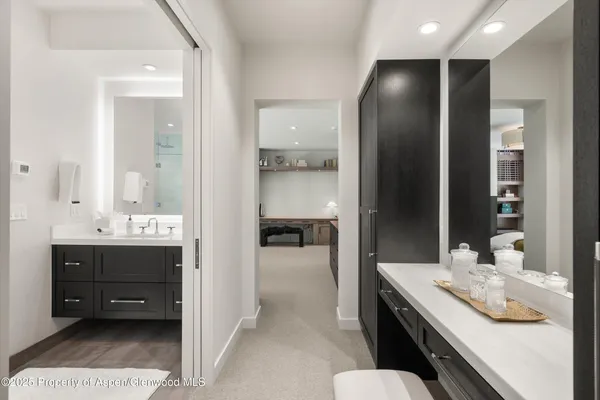 a en suite bathroom with a sink and a mirror