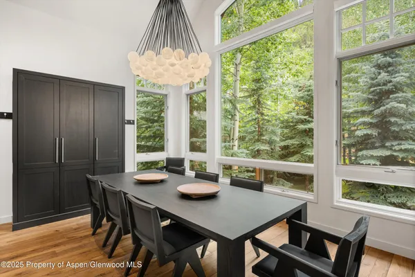 a view of a dining room with furniture window and outside view