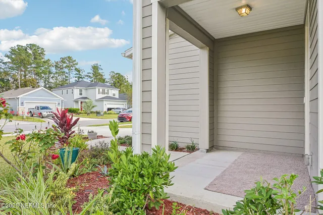 a view of a kitchen with sink and wooden floor