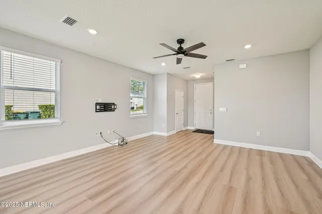 a view of a big room with carpet