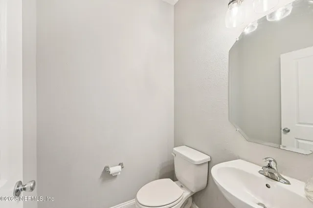 a view of a livingroom with a ceiling fan and window