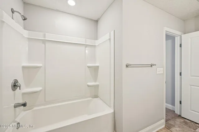 a view of outdoor space with playground and green space