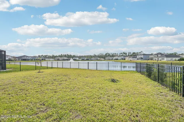 a view of a dining room with furniture and window