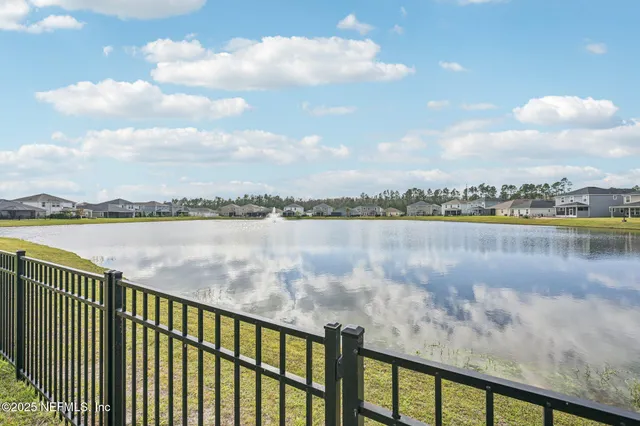 a front view of a house with a potted plant and a potted plant