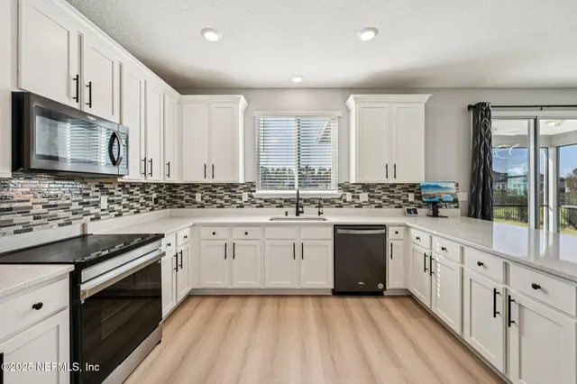 a view of a dining room with furniture and window