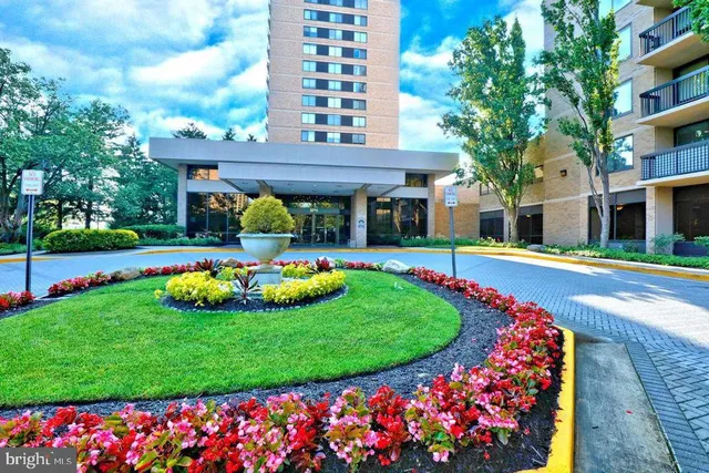 a front view of building with yard