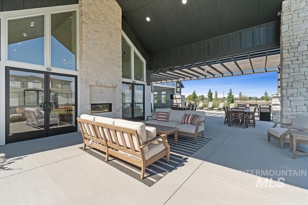 744 South Calhoun Lane Star, ID 83669 - Photo 11 of 18 View of patio / terrace with french doors, outdoor lounge area, outdoor dining space, and a pergola