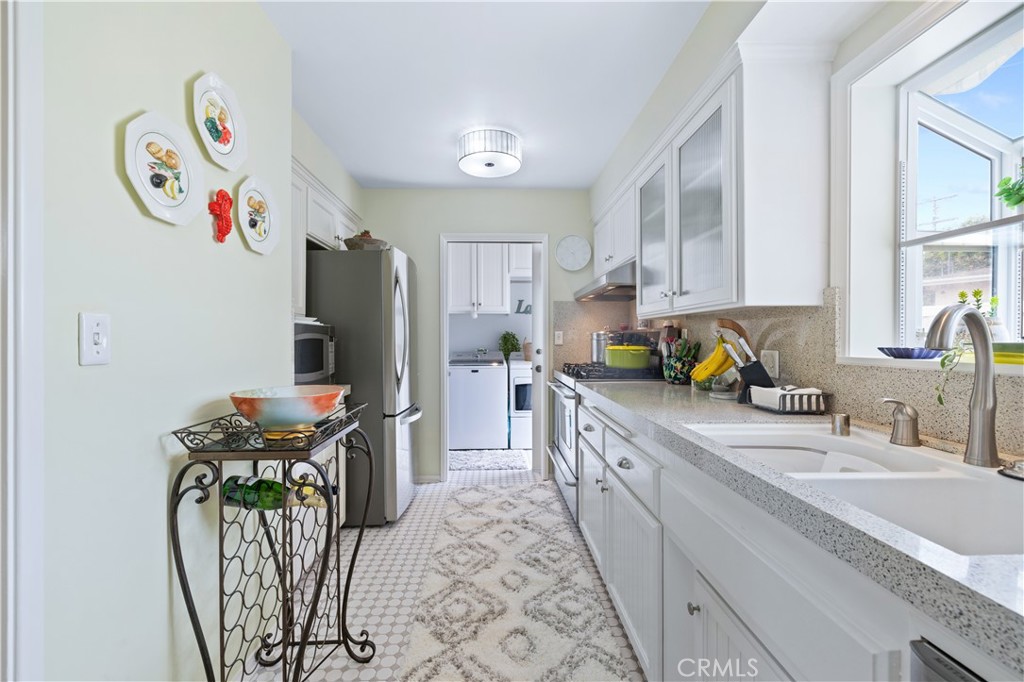 208 West Avenida De Los Lobos Marinos San Clemente, CA 92672 - Photo 15 of 33 a kitchen with stainless steel appliances granite countertop a refrigerator and a sink
