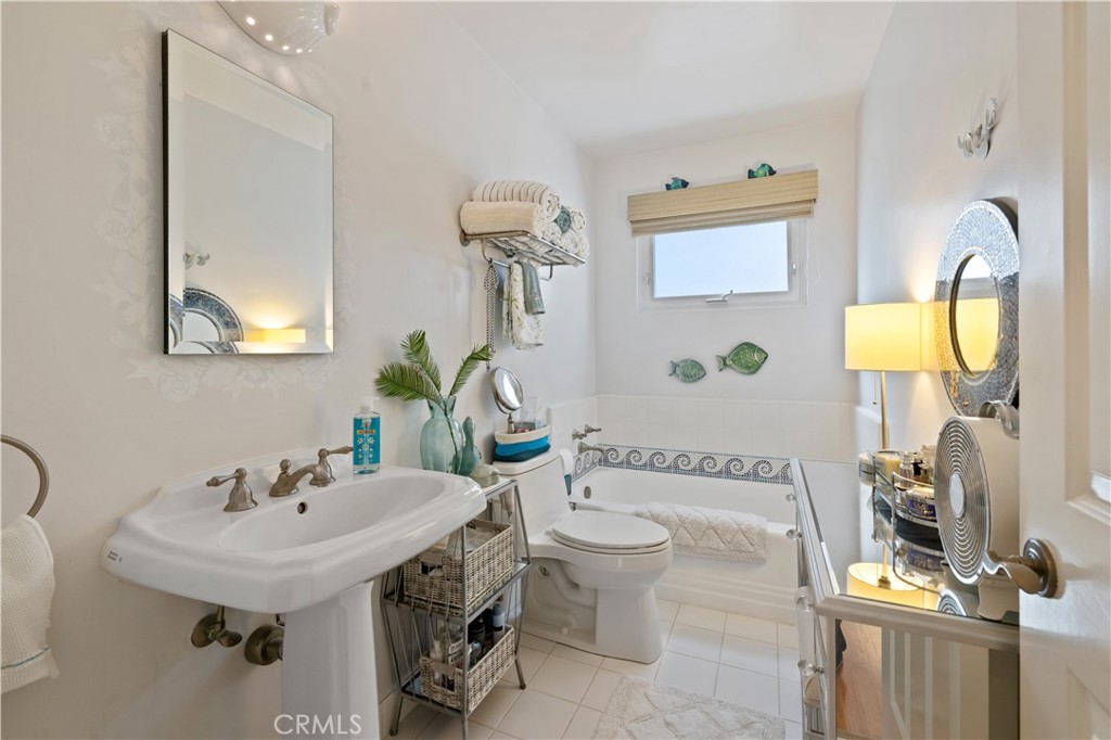 208 West Avenida De Los Lobos Marinos San Clemente, CA 92672 - Photo 23 of 33 a bathroom with a sink and a mirror