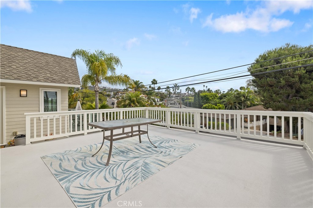 208 West Avenida De Los Lobos Marinos San Clemente, CA 92672 - Photo 27 of 33 a view of a chair and table on the deck