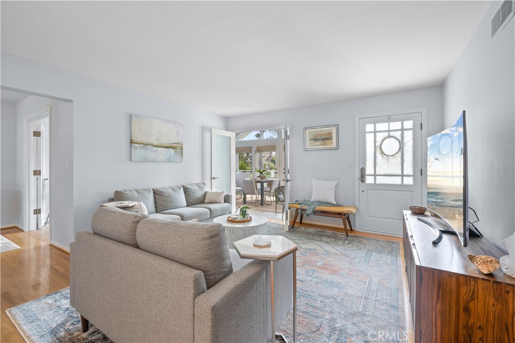 208 West Avenida De Los Lobos Marinos San Clemente, CA 92672 - Photo 8 of 33 a living room with furniture and a flat screen tv